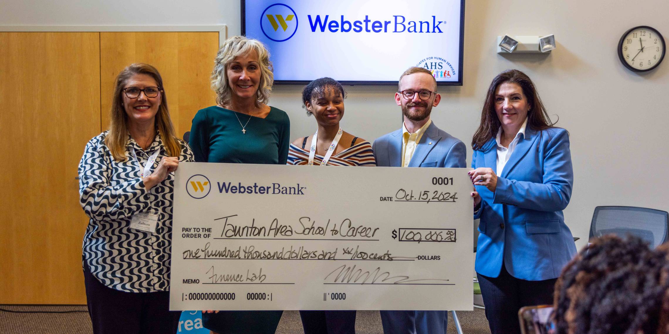 Webster Bank presents oversized check to Taunton Area School to Career