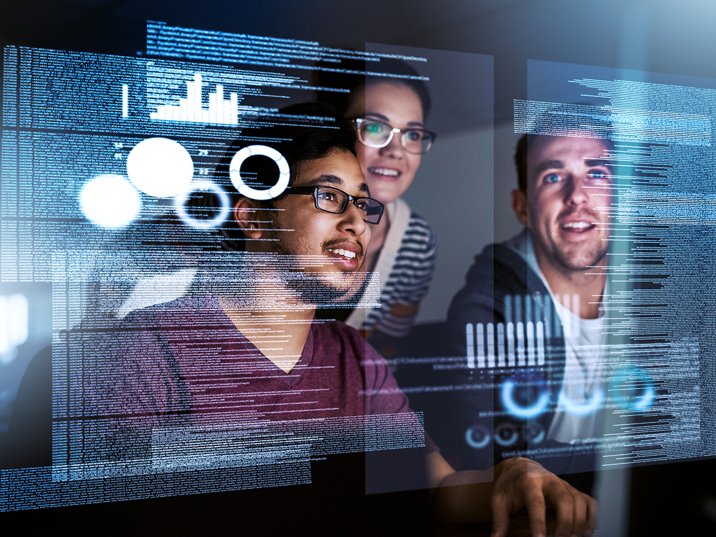 3 tech professionals looking at a screen
